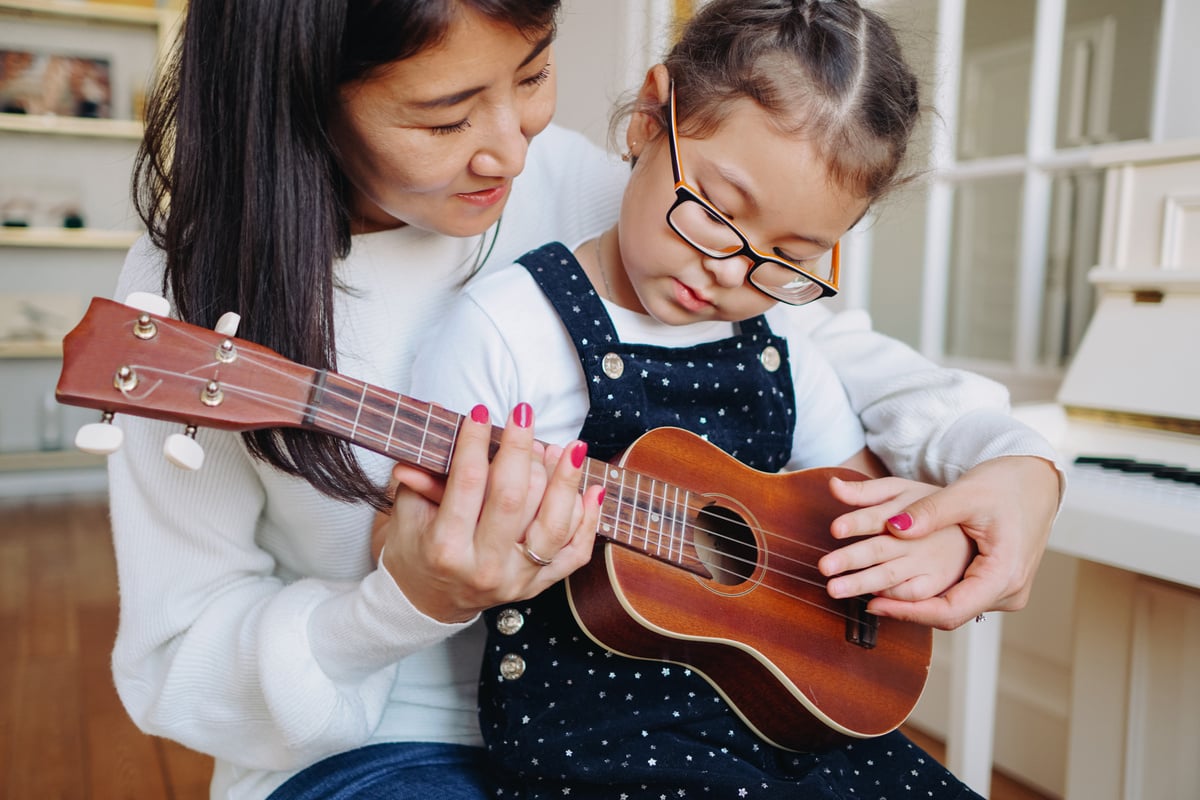 Mother and Kid Playing Ukulele 